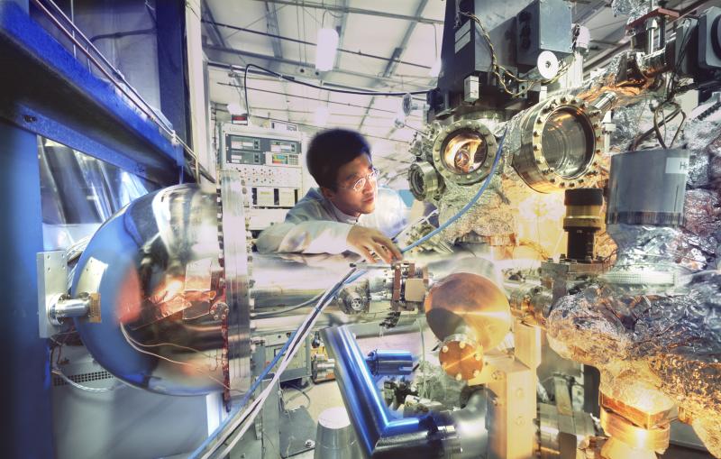 Physicist checking experimental equipment at Stanford Synchrotron Radiation Lightsource (SSRL).