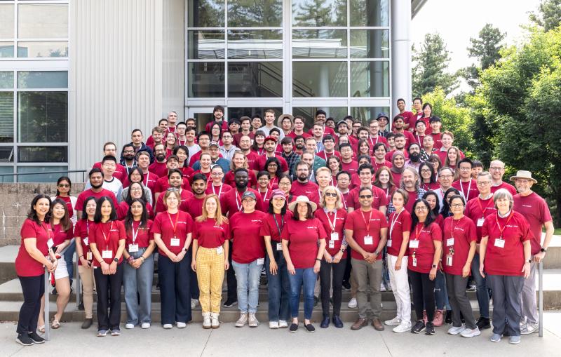 A group photo of people in red tee shirts.