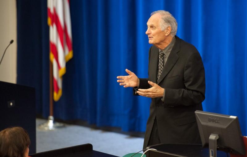 Photo - Alan Alda speaking in front of auditorium