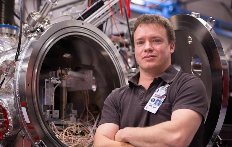 Photo - Daniel DePonte standing in experimental station.