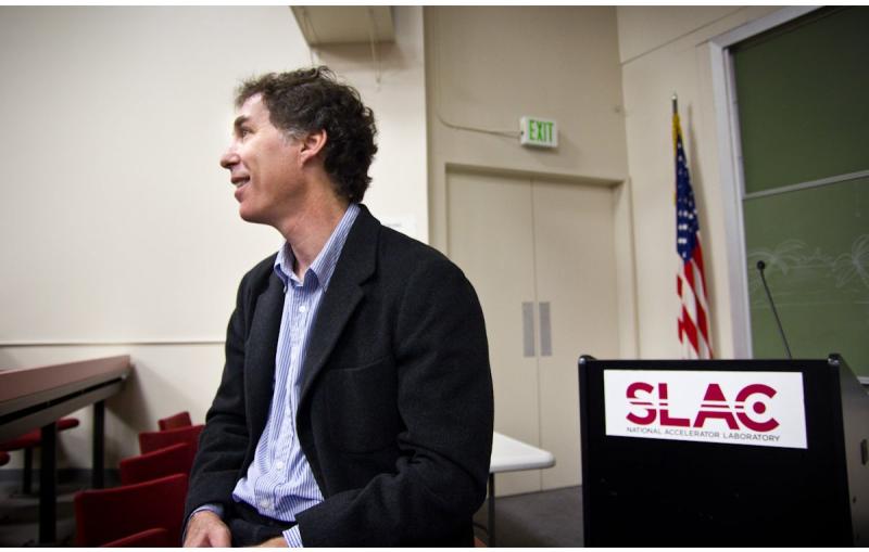 Photo - SLAC software developer Joseph Perl sSLAC software developer Joseph Perl sitting in front of lectern