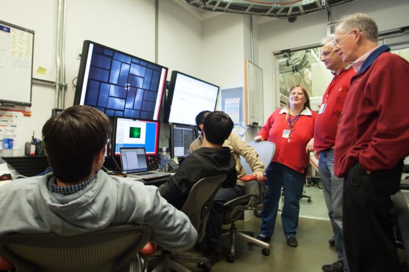 Image - An X-ray diffraction pattern, produced as a pulse at SLAC's Linac Coherent Light Source struck a crystallized G-protein coupled receptor (GPCR) sample, appears on a panel display (at left) at the Coherent X-ray Imaging control room.