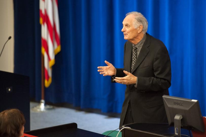 Photo - Alan Alda speaking in front of auditorium