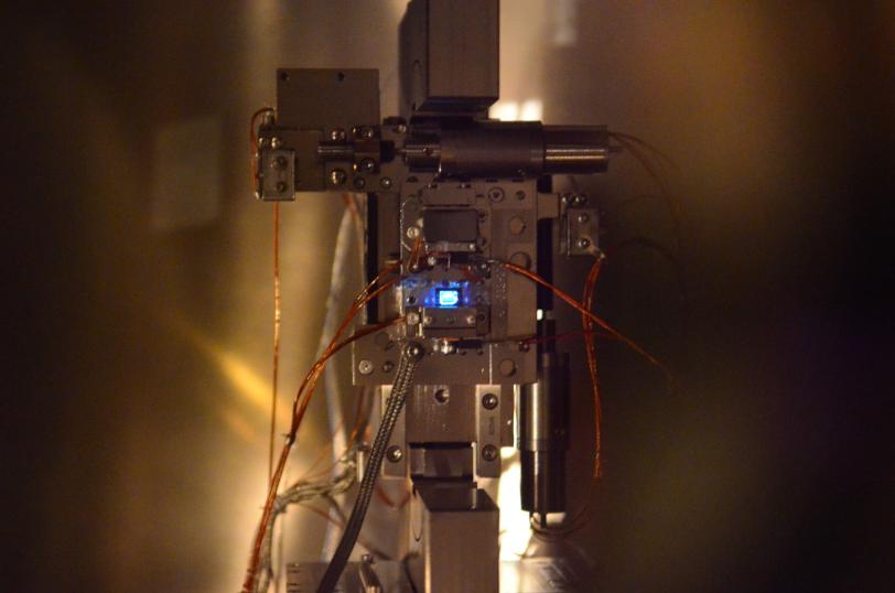 Image - A superthin diamond glows blue during a beam-sharing experiment at SLAC's Linac Coherent Light Source X-ray laser. (Credit: Diling Zhu, SLAC)