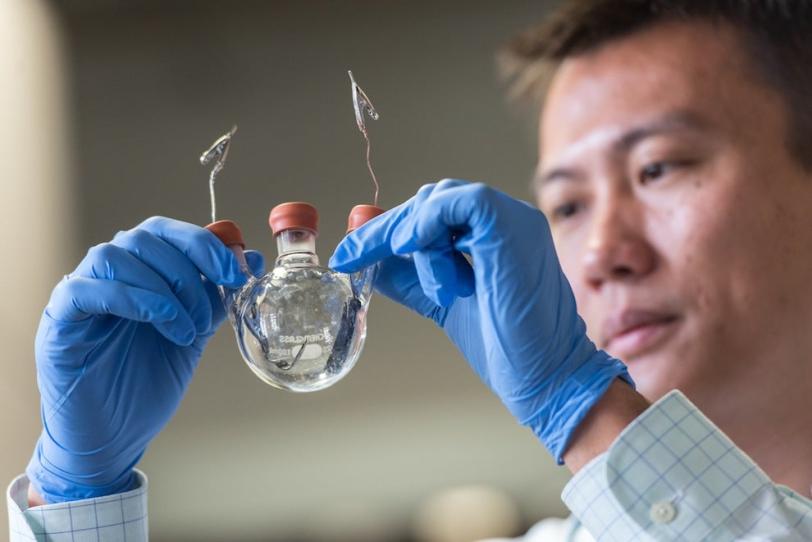 Photo - Professor Yi Cui holding empty battery demons...