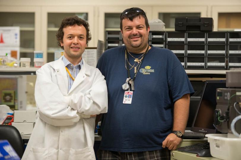 Photo - Hasan Demirci, left, a visiting researcher fr...