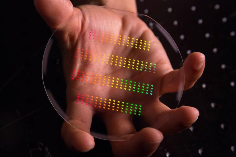 The nanoscale patterns of SLAC and Stanford's accelerator on a chip gleam in rainbow colors prior to being assembled and cut into their final forms. (Matt Beardsley/SLAC)