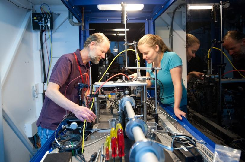 Mike Toney and Johanna Nelson peer into the Xradia transmission X-ray microscope at SSRL