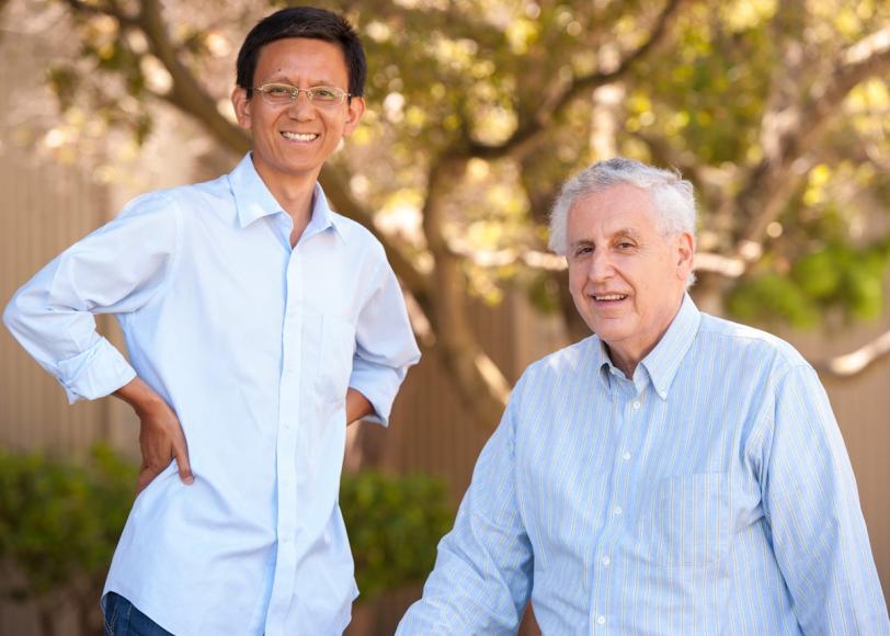 Theoretical Physicists Xing-Gang Wu and Stan Brodsky