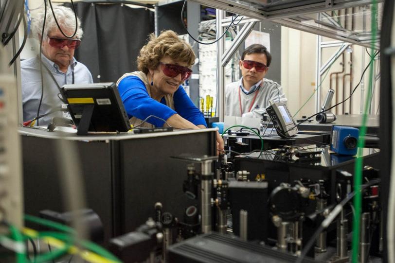 Photo - SLAC's Sasha Gilevich, middle, works on laser...