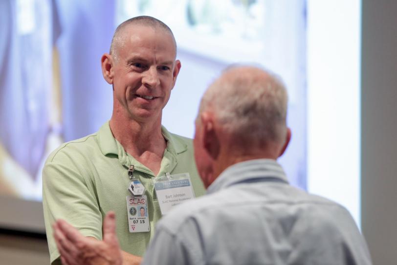 Image - Bart Johnson of SLAC's Stanford Synchrotron Radiation Lightsource is congratulated by X-ray science luminary Farrel W. Lytle after receiving an annual award. (SLAC National Accelerator Laboratory)