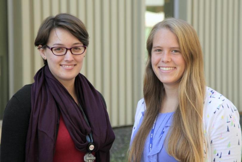 photo - two scientists in front of a building - see caption