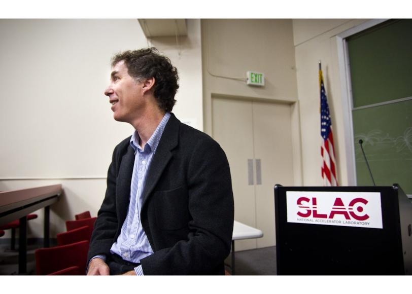 Photo - SLAC software developer Joseph Perl sSLAC software developer Joseph Perl sitting in front of lectern