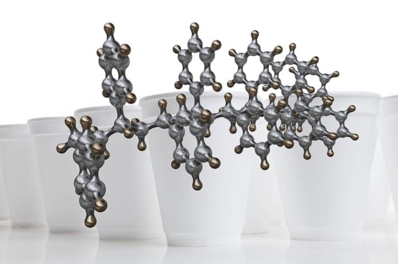 Illustration of a polystrene molecular chain and Styrofoam cups, which are made of polystyrene.