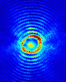 : Image – Cross-section of plasma-walled channel showing the positron bunch traveling through it.