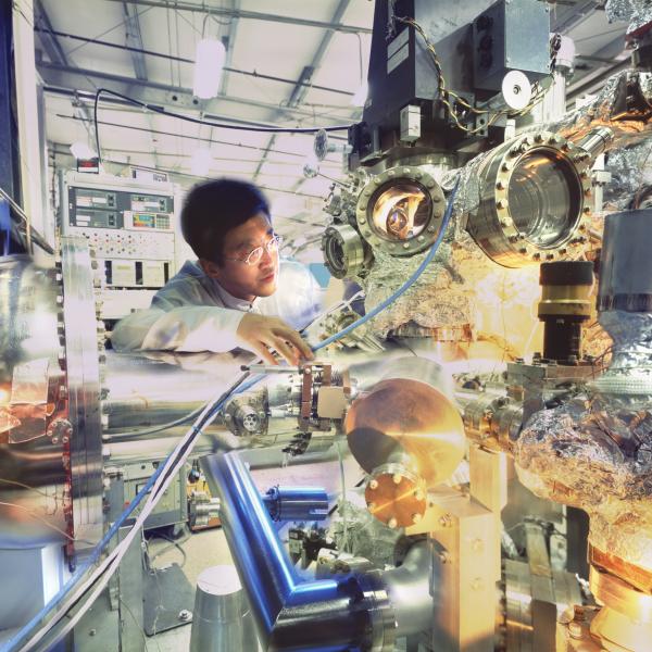 Physicist checking experimental equipment at Stanford Synchrotron Radiation Lightsource (SSRL).