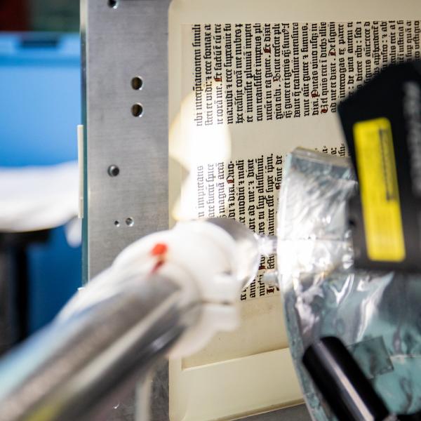 A page of the Gutenberg Bible from 1450-1455 AD is prepped before being scanned at SSRL beamline 7-2. 