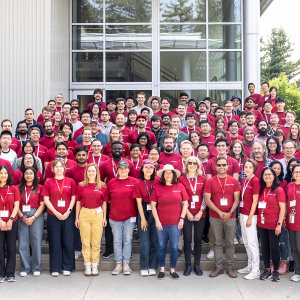 A group photo of people in red tee shirts.