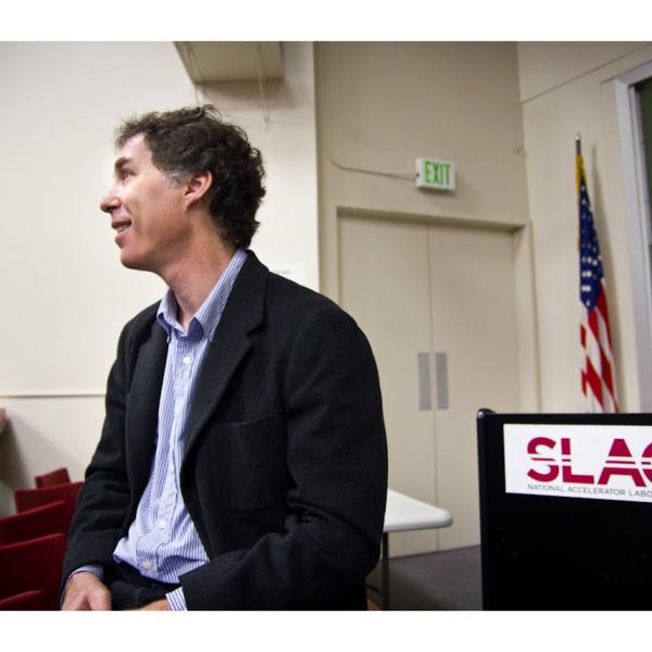 Photo - SLAC software developer Joseph Perl sSLAC software developer Joseph Perl sitting in front of lectern